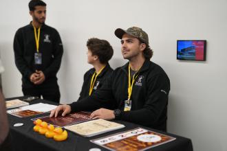 A student sits at a table.