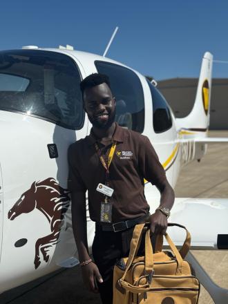 Man in front of plane