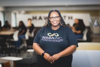 Dr. Brittani Shantel Jackson, CPA wearing NABA Inc. t-shirt in Haworth College of Business