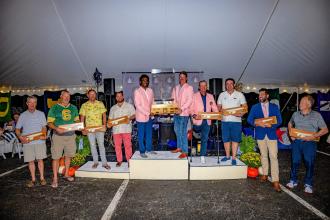 Winners stand on a podium after a competition.