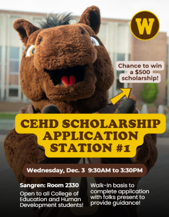 Buster Bronco standing in front of Miller Auditorium. 