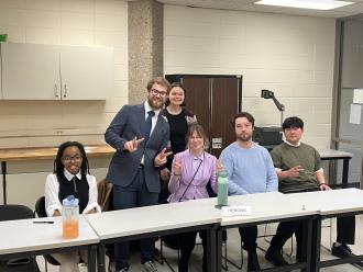 2025 Ethics Bowl team with coach Emily Alberty