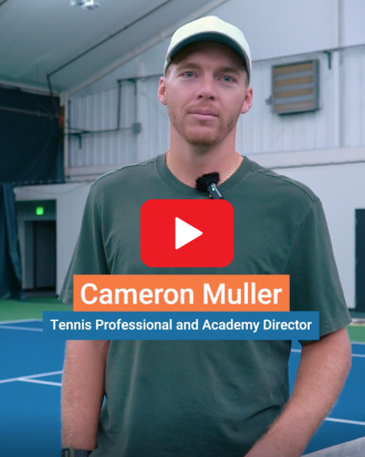 Cam Muller in front of a tennis net