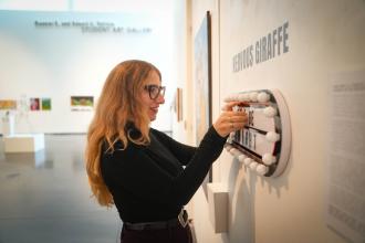 Hope Donovan installs a sign.