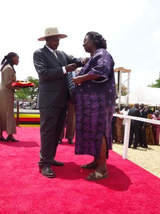 Dr.Betty Udongo recieving the presidential victoria medal award of honor 2012