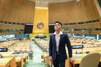 Mehran Najafi stands on the floor of the United Nations General Assembly in New York City.