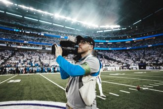 Max Hahn honing his draft, filming a Detroit Lions game. 