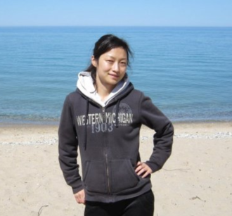 Qi enjoys visiting Lake Michigan beaches close to Kalamazoo.