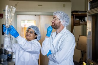 Valliammai Palaniappan and Tony Hanson work in the lab that supports EV battery and semiconductor teaching and research.