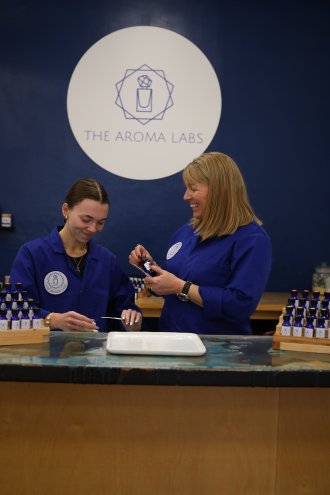 Tanya Thompson works with her daughter Ava Thompson at the blending bar inside The Aroma Labs in Kalamazoo.