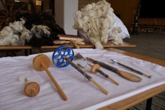 Several spinning tools laid out on a table.