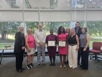 2025-2026 Burgett Scholarship Recipients with family and program faculty