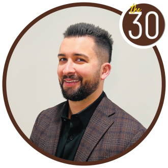 joseph Guarino standing in front of a white background