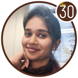 Sahana Madhanagopal, MBA’18 sitting in front of a window