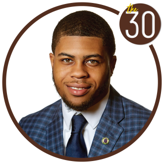 Ronald Nicholson, B.B.A.’18 in a suit