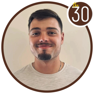 Trenton Sands, B.B.A.’23 in front of a beige background