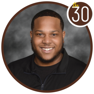 Donte' Tuggle in front of a gray background