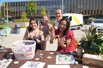 A group of students in the EcoBroncos student organization gather for a photo.