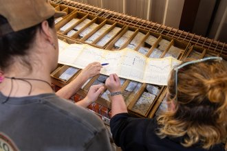 Students examine data on a graph.