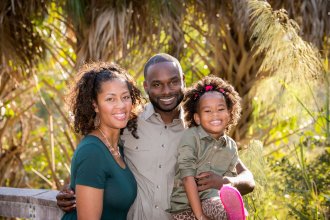 WMU Aviation Alumna Sharmaine Moulton with her husband and daughter