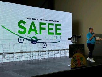 Sharmain Moulton, WMU Aviation Alumna making a presentation to 4,000 kids at the South Florida Expo