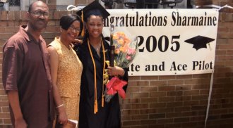 WMU Aviation Alumna Sharmaine Moulton with her parents at her WMU graduation