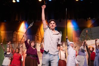 Jack Austin raises his arm into the air.