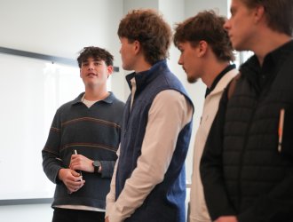 Travis Fraley with management classmates at Sleeping Giant Capital