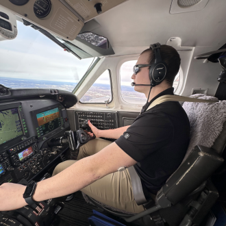 Student flying in plane.