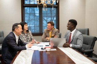 A personal financial planning meeting with President Russ Kavalhuna.