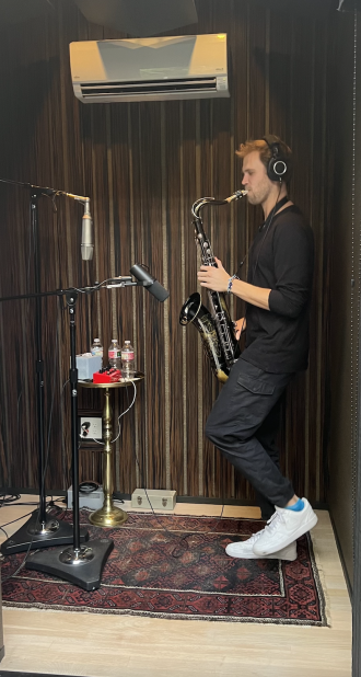 Henry Koperski plays the saxophone.