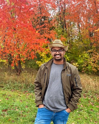 An international student from India poses during graduation season.