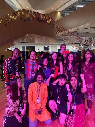 International students pose together at an event.