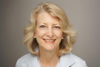 Nancy McGaw wearing a light-colored jacket