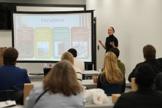 A WMU Haworth student presents consulting findings to Douglas Community Association during a spring 2026 final presentation.