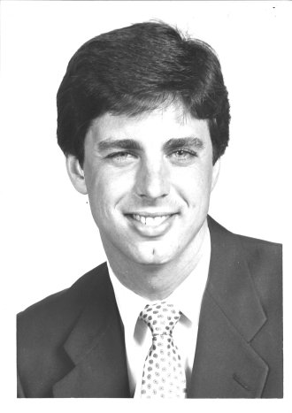 A black and white portrait of Dave Dombrowski.