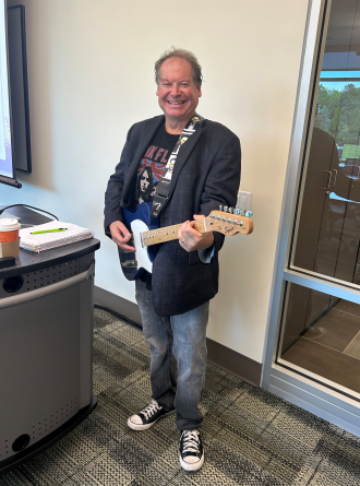 Dr. Feffer holding his guitar