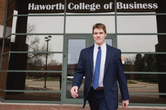 Grant Slukynsky walks out of Schneider Hall.
