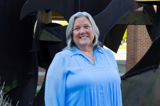Jeannine Shafer outside Schneider Hall on WMU's campus