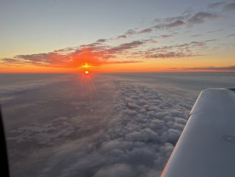 Photo of a sunset from a WMU Cirrus SR20
