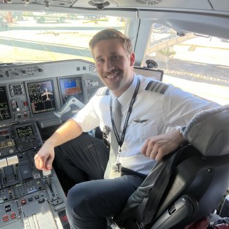 WMU Aviation Alumni Joe Zynda in the flight deck of his aircraft