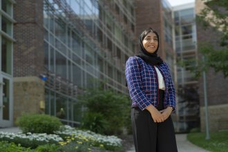 A portrait of Khadeja Al Muhaisin outside the College of Health and Human Services.
