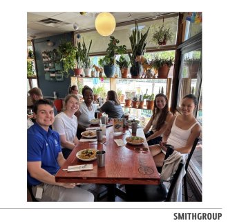 Abby Naugle at a table with other Smithgroup Interns.
