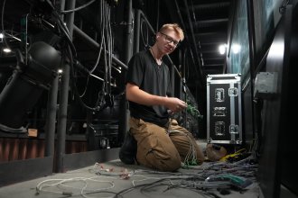 Ben Franz works with audio cables.