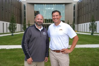 President Kavalhuna and Provost Cheatham standing in photo