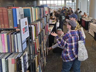Visitors view books at the International Congress of Medieval Studies