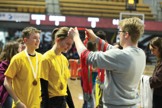 Student receiving medal at Science Olympiad