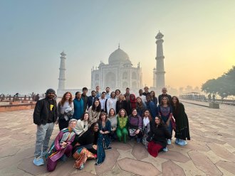 A group of WMU study abroad students pose by the Taj Mahal in Agra, Uttar Pradesh, India.