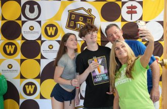 A family takes a selfie.