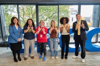 WMU President Russ Kavalhuna stands with GRCC president and students.